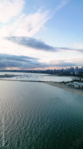Aerial fly over Port Phillip Bay to reveal Melbourne skyline and St.Kilda bayside