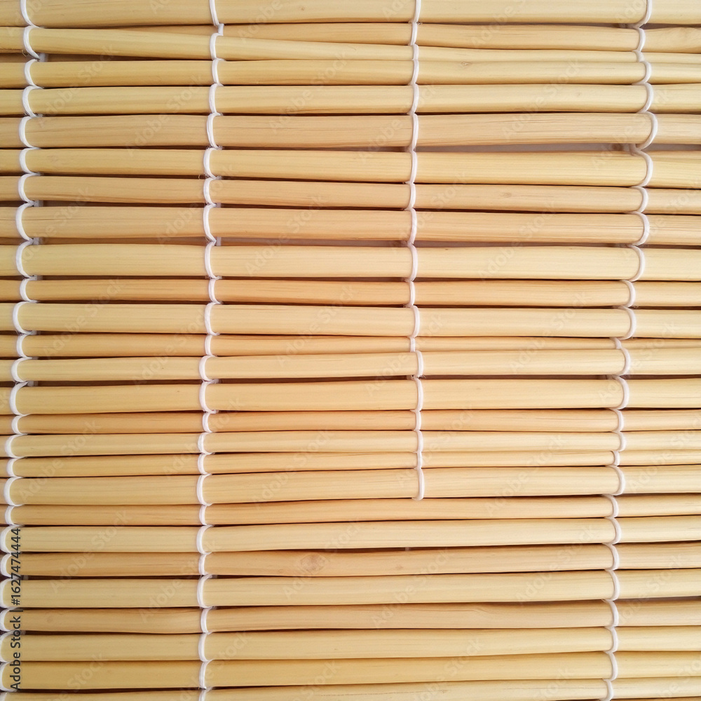 Close up of a bamboo mat texture background with natural light Close up of a bamboo mat texture background with natural light