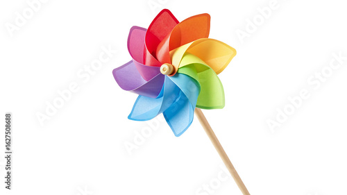 Colorful rainbow pinwheel spinning in the wind against a black background summertime decoration item