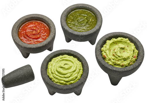 Colorful assortment of salsa, guacamole, and sauce in traditional stone bowls