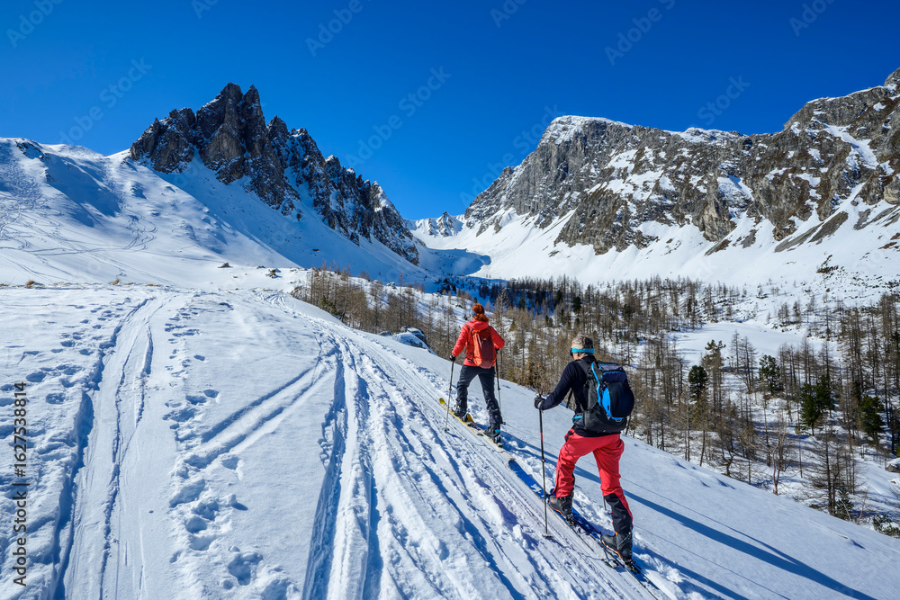 Backcountry skiing in Lower Tauern mountains Austria under blue sky Backcountry skiing in Lower Tauern mountains Austria under blue sky