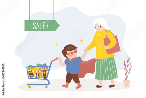 Little boy helping grandmother push shopping trolley, kids good manners concept. Boy helper and aged woman. Happy kid wearing super hero costume.