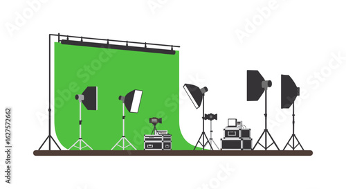 Photography studio setup with green screen and lighting equipment