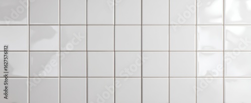 The Elegant Arrangement of Glossy White Ceramic Tiles on a Wall