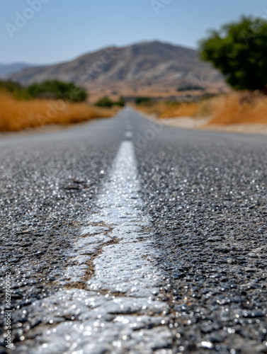 Wallpaper Mural A straight road stretches into the distant hills under a clear sky. Torontodigital.ca