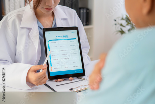 Wallpaper Mural Asian nutritionist using tablet to explaining personalized meal plan with AI to patient during healthcare consultation, healthy lifestyle, woman dietitian showing nutrition plan with AI on tablet. Torontodigital.ca
