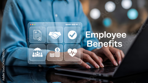 Person types on laptop with employee benefits icons displayed on a screen
