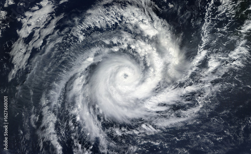 Fototapeta Naklejka Na Ścianę i Meble -  Super Typhoon, tropical storm, cyclone, hurricane, tornado, over ocean. Weather background. Typhoon,  storm, windstorm, superstorm, gale moves to the ground.  Elements of this image furnished by NASA.