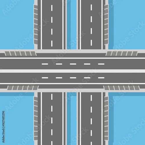Aerial view of a road intersection or overpass with light blue background.