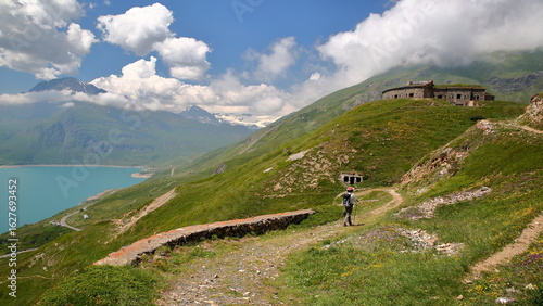 Lac du Mont Cenis (Mont Cenis lake) pictured from a hiking trail north of the lake, Savoie, Northern French Alps, France, with  a moutain range and the fort de Ronce (Ronce fort), built in 1877 
