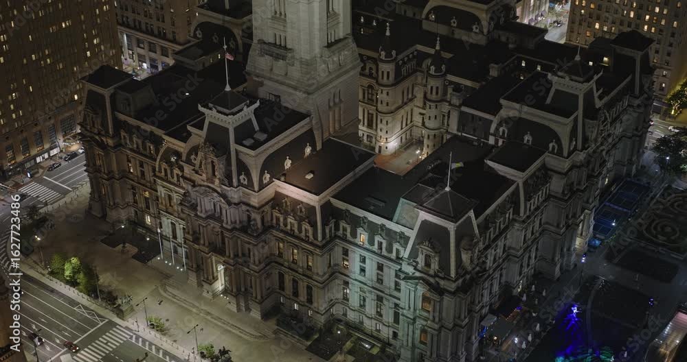 Philadelphia Pennsylvania Aerial v127 reverse flyover city center, capturing City Hall, a grand historic landmark shining amidst towering skyscrapers at night - Shot with Inspire 3 8k - Sept 28th 2023