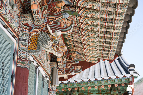 Wallpaper Mural Dragon wooden sculpture on a roof in a Traditional Korean Beomeosa Temple Torontodigital.ca