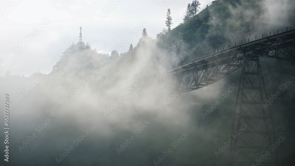 Fototapeta premium Fog flowing on the monorail funicular track