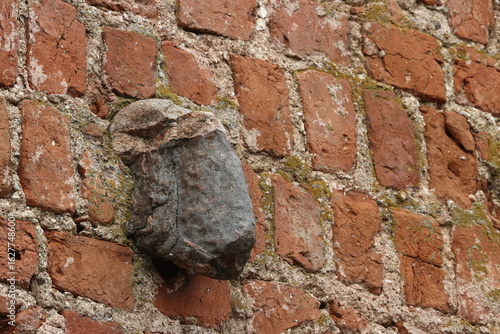 A stone resembling a ram's head in the wall of Mir Castle. Mir city. Belarus