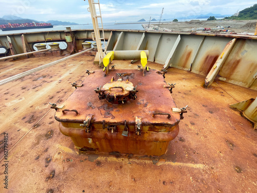 Access hatch to forepeak compartment of the cargo ship in very poor condition with heavy corrosion