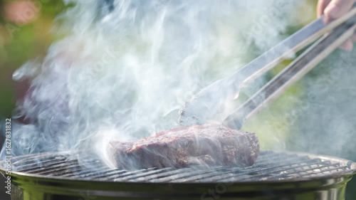 Wallpaper Mural fresh juicy steak grilling on hot charcoal grill in backyard garden, food closeup, outdoor cooking Torontodigital.ca