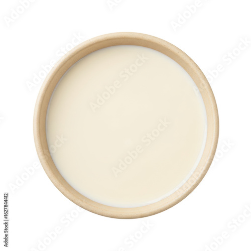 A smooth, creamy substance in a wooden bowl, set against a plain background, ideal for culinary use