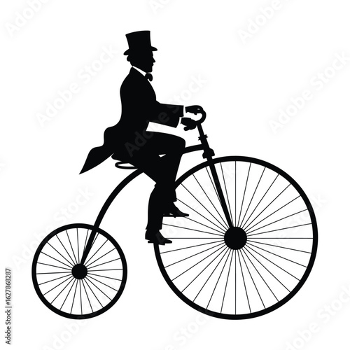 Silhouette of a gentleman in a top hat riding a vintage penny farthing bicycle