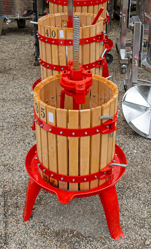 Photography Traditional wine making grape press tools outside in agricultural field in count