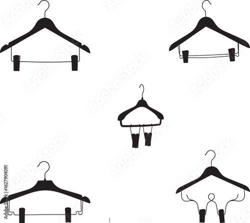 Collection of five black clothing hangers in a silhouette style isolated on transparent background