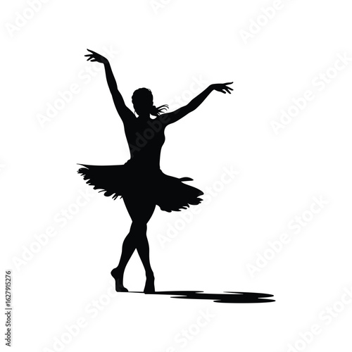 Silhouette of a graceful ballerina performing a dance pose on pointe shoes