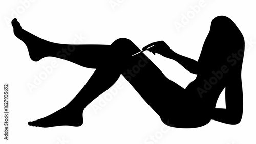 Silhouette of a woman lying down with legs raised and holding a thin object near her knee in black