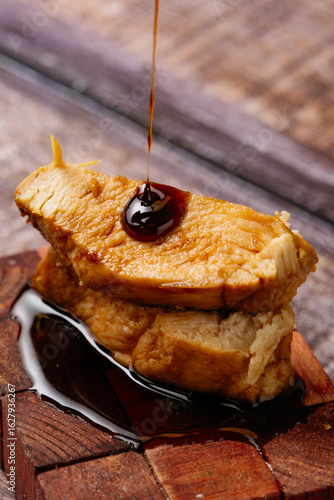 Piece of chicken cut into portions seasoned with soy sauce.