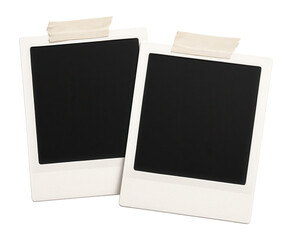 Two blank instant photo frames taped with adhesive tape are displayed diagonally on transparent background.