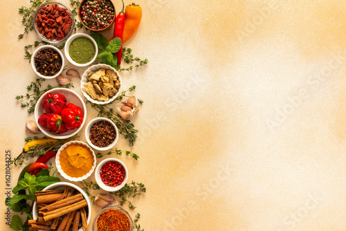 Wallpaper Mural Assortment of vibrant spices and herbs on a warm beige background, showcasing a natural and aromatic palette for culinary inspiration, top view and copy space Torontodigital.ca
