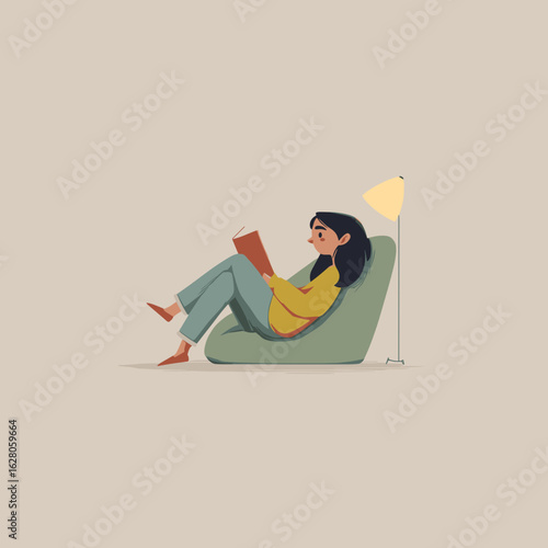 Young woman reading a book while sitting on a bean bag chair  