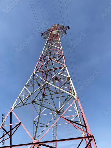 Electric power lines closeup against blue sky