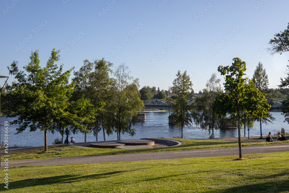 Fototapeta premium Urban nature in Umea Sweden showing the peaceful parklands and walking trails by the Ume river in Vasterbotten County.