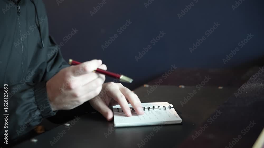 Hands Writing in Notebook – Close-Up of Manual Notes and Planning