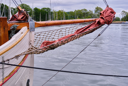 Photos Curved Bow With Bowsprit Net And Jib Sails On White Wooden Sailboat Lauterbach
