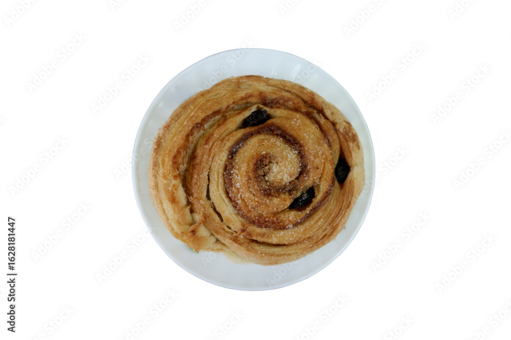 Fototapeta premium Freshly Baked Danish Pastry with Raisins and Sugar Topping On a White Plate