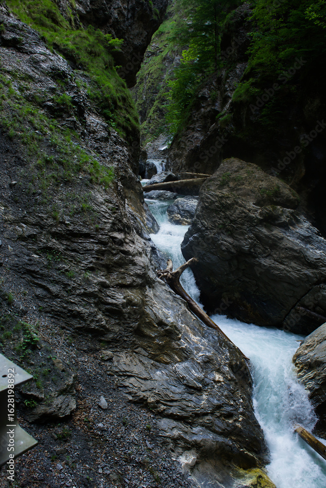 Obraz premium Nature's masterpiece Unwind with the soothing sounds of Liechtensteinklamm waterfalls, nestled in the Austrian Alps.
