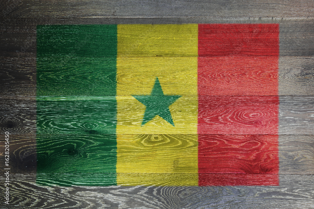 Fototapeta premium Senegal flag on rustic old wood surface background