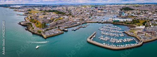 Aerial view of Plymouth Hoe and Royal Citadel along the waterfront in Plymouth, England, with cityscape and marina in the background