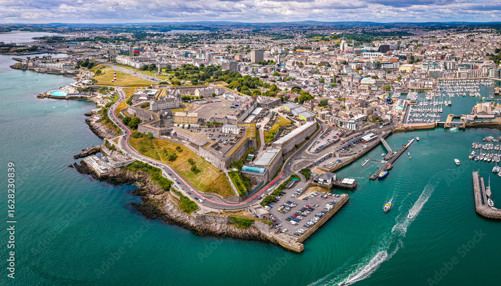 Fototapeta premium Aerial view of Plymouth Hoe and Royal Citadel along the waterfront in Plymouth, England, with cityscape and marina in the background