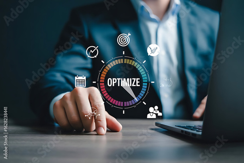 Business Professional Pointing at Optimization Graphic Surrounded by Icons Representing Efficiency, Data Analysis, and Strategic Teamwork