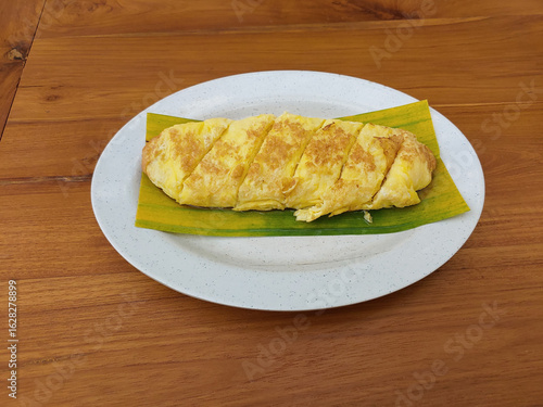 Egg Roll Omelette or Telur dadar gulung or Tamagoyaki or Japaneses egg roll. Gyeran Mari or Korean Rolled Omelette. fried egg