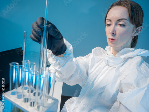 Scientist in protective sui...