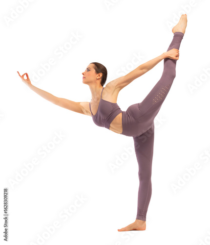 Young woman doing yoga or dance exercise