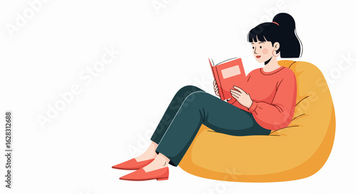 Young woman with a ponytail in a red sweater, sitting on a yellow beanbag chair and reading a book.