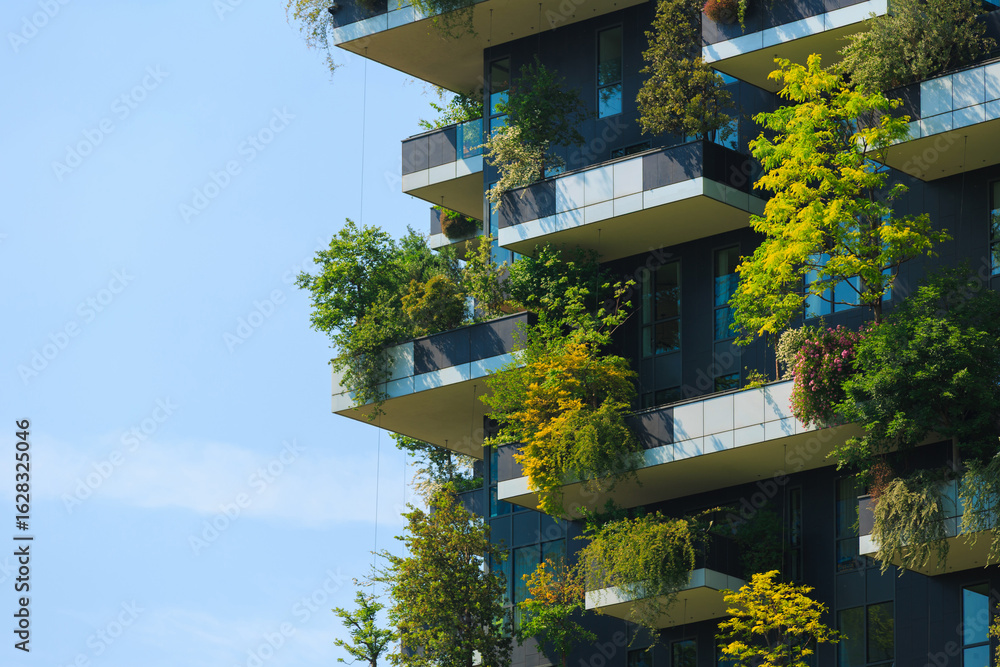 A unique building showcases balconies adorned with lush plants and green energy in an urban setting under a clear sky. A unique building showcases balconies adorned with lush plants and green energy in an urban setting under a clear sky.