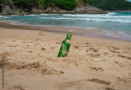 Bottle Glass Of Water On The Beach