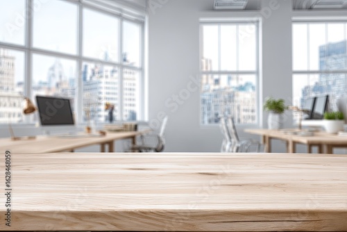 Light-colored wooden table top, foreground, in a modern office.  Blurred cityscape and interior details in the background