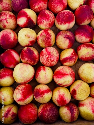 ripe whole white freestone peaches at farmers market 