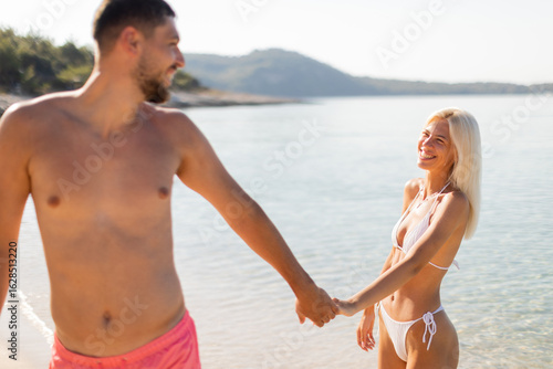 Couples enjoying a sunny be...