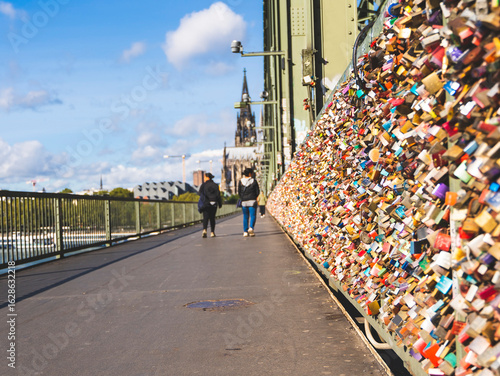 Love Locks on the Hohenzollern Bridge and the view of cathedral in Cologne, Germany